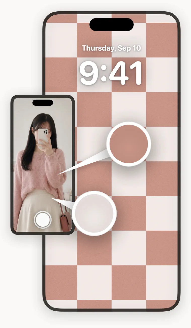 A mirror selfie in a pink sweater, beside the checkered wallpaper built from its colors